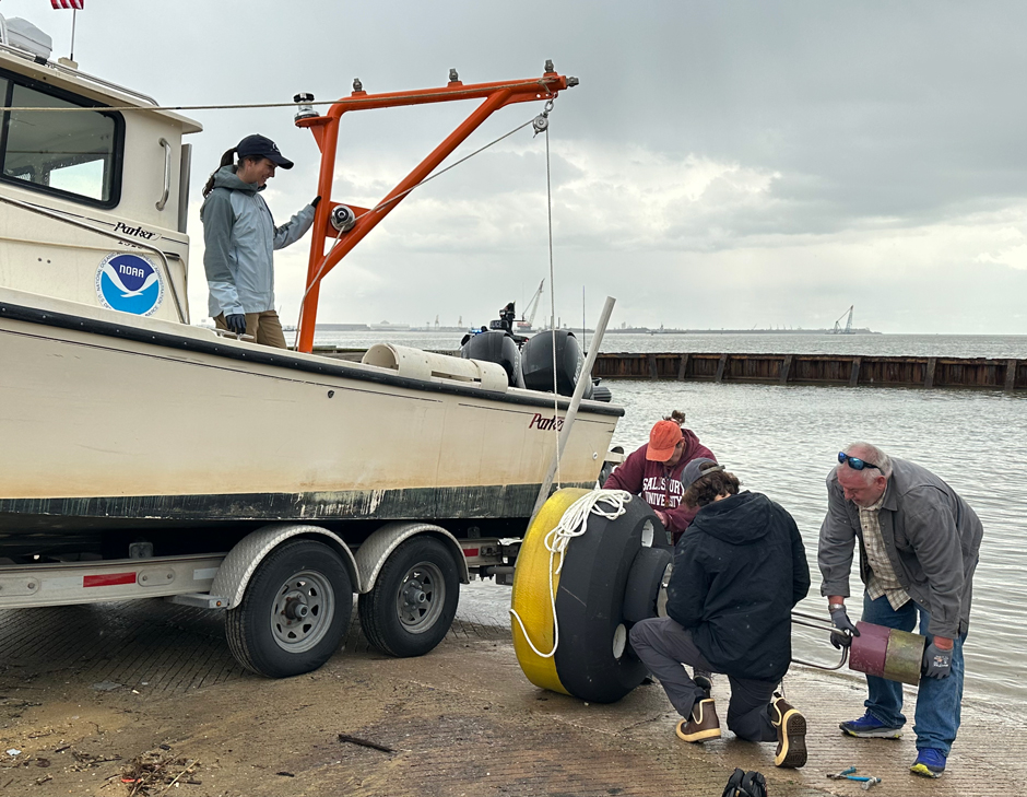 The currents real-time buoy, CURBY, is assembled on-site by a small team of NOAA engineers and oceanographers. 