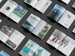 Overhead view of multiple article spreads from the 2024 Fall edition of the Environmental Monitor