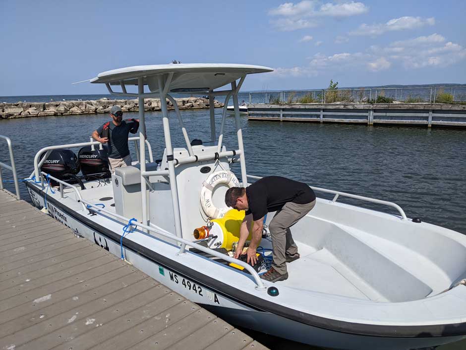 Dr. Chris Houghton (left) and Dr. Mike Zorn (right) gear up for another LoRa buoy deployment onboard UW-Green Bay’s R/V Phoenix. 