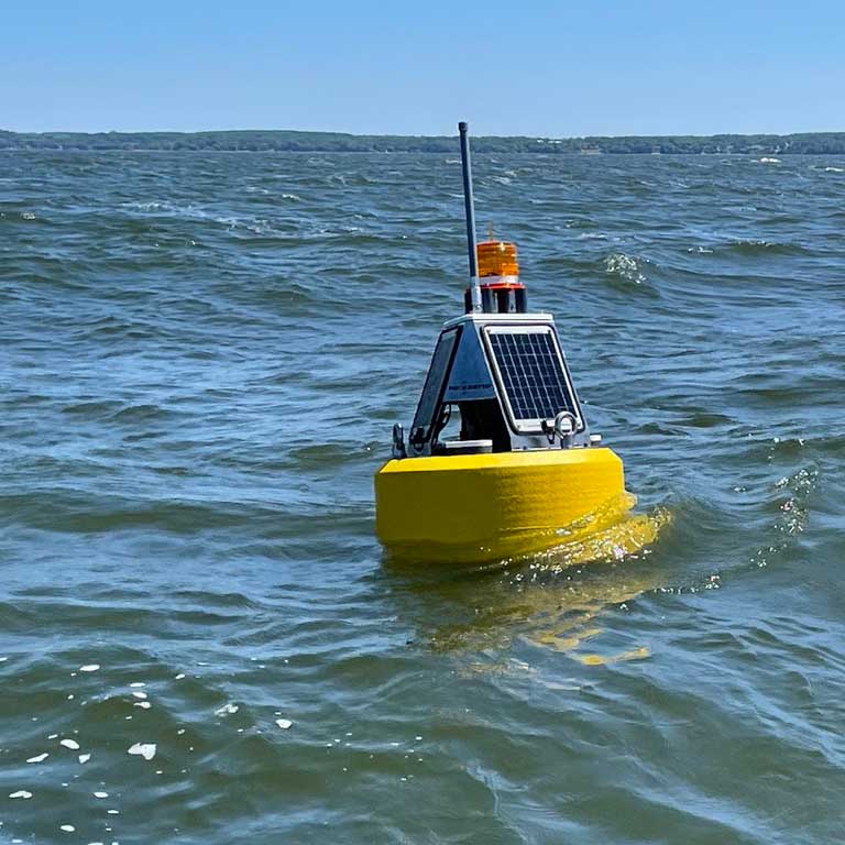 Gleaming and new, the first LoRa buoy is deployed in lower Green Bay, ready to collect valuable, real-time surface algal pigment, temperature profile, and dissolved oxygen data for its first season.