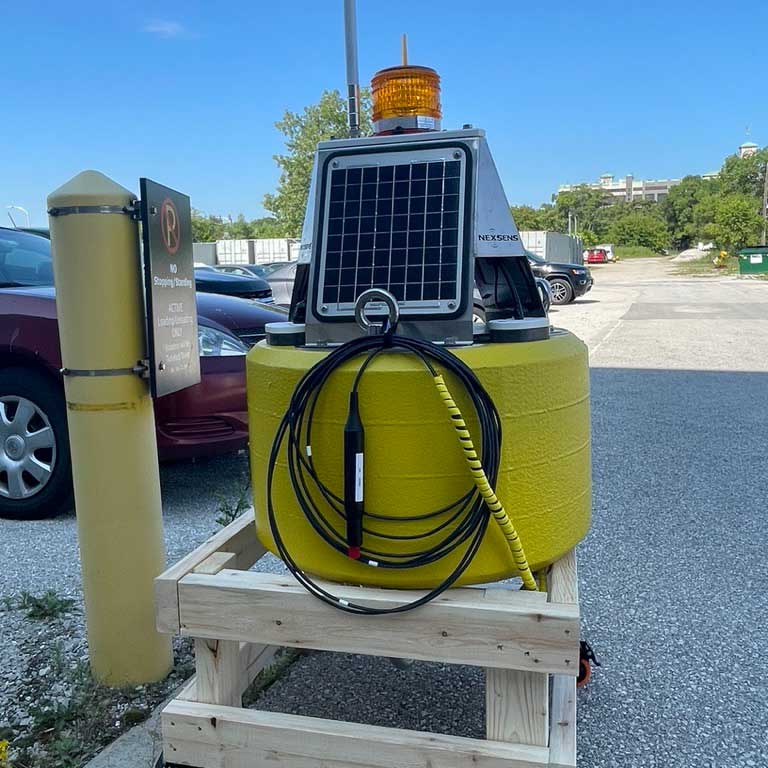 Prior to deployment, each system undergoes rigorous testing on dry land, i.e., the parking lot, to ensure all components are working properly including solar charging, water-tightness, and LoRaWAN signal strength.