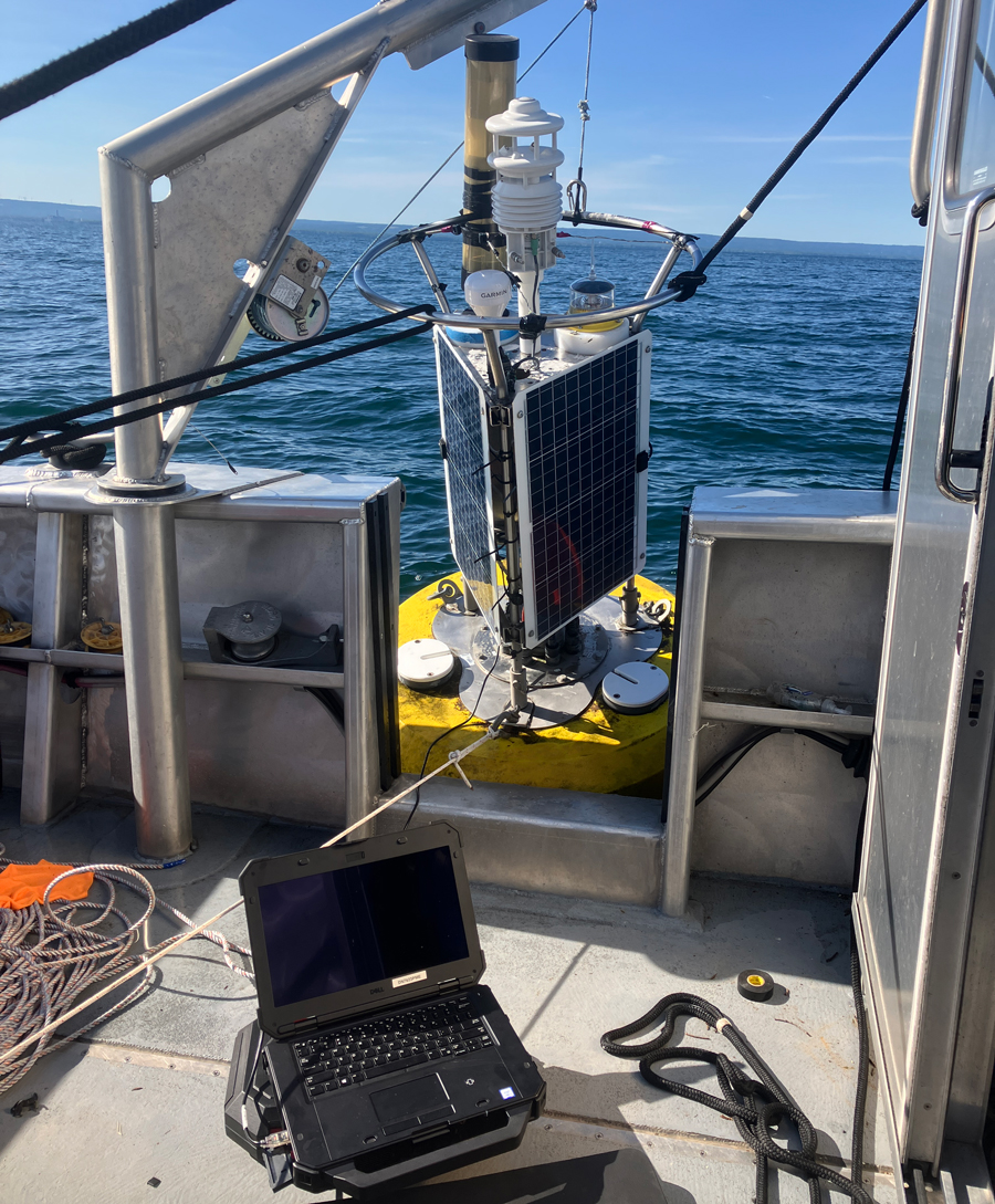 The Dunkirk Buoy is winched up and secured to the research vessel so that it can be connected to a laptop on board to troubleshoot cellular connectivity issues.